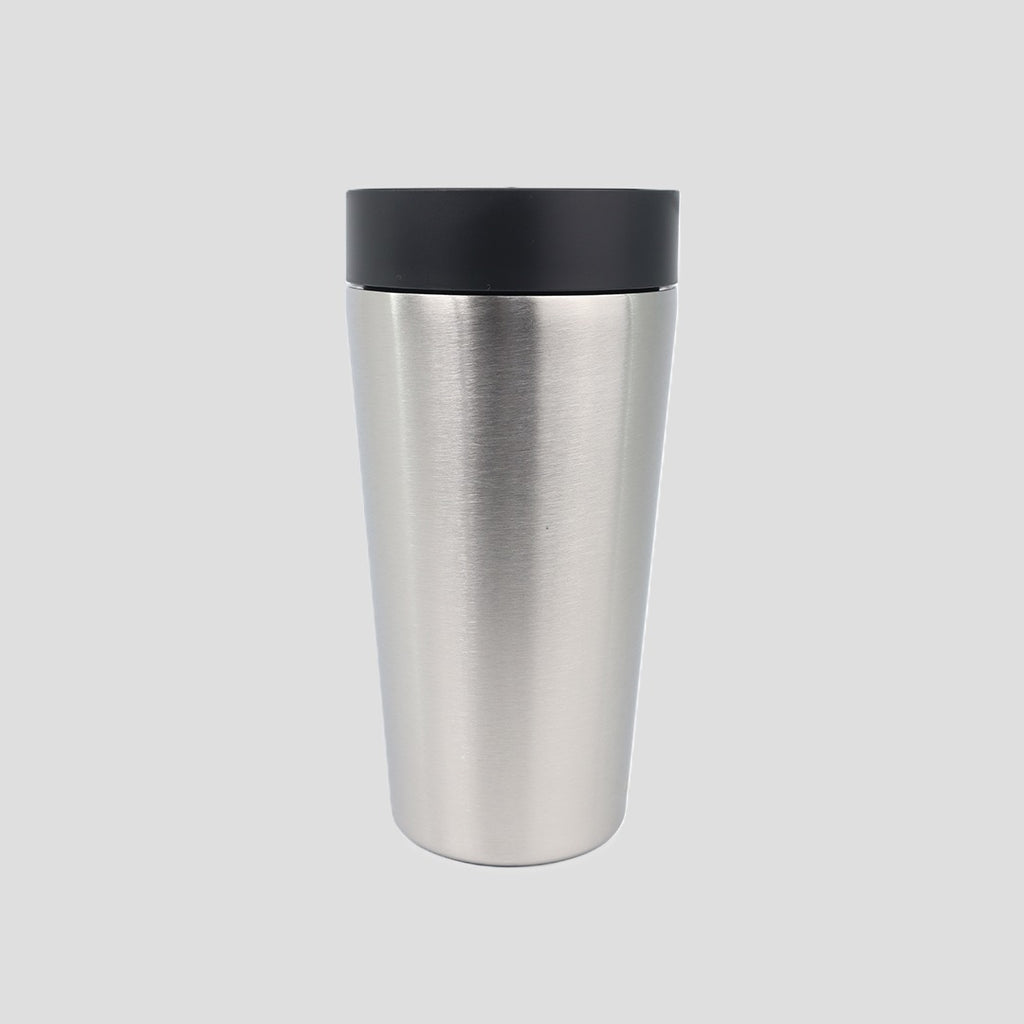 A brushed stainless steel travel tumbler with a black lid, centered on a light gray background.