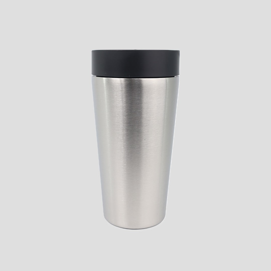 A brushed stainless steel travel tumbler with a black lid, centered on a light gray background.