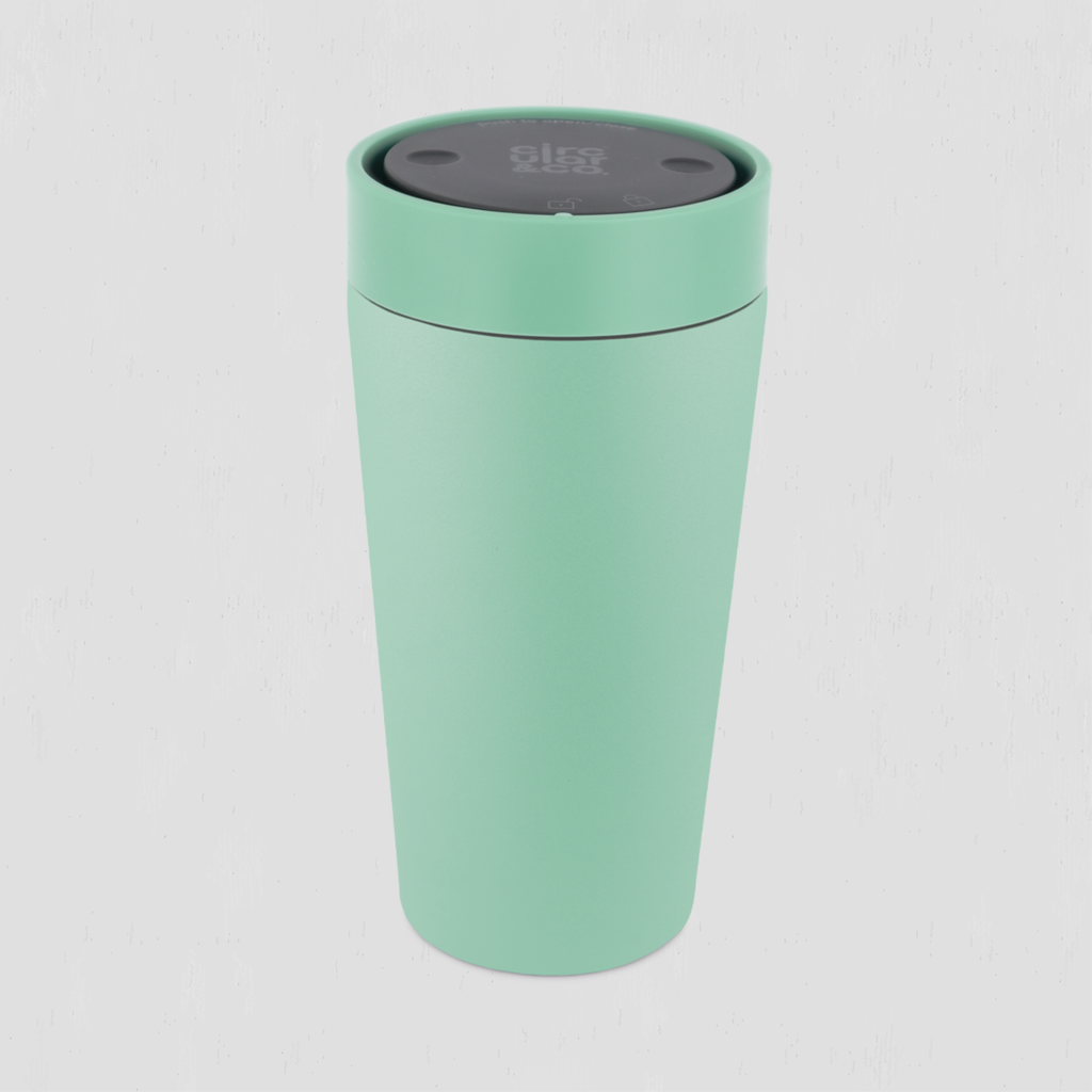 A mint green stainless steel travel cup with a dark gray lid, shown on a light gray background.