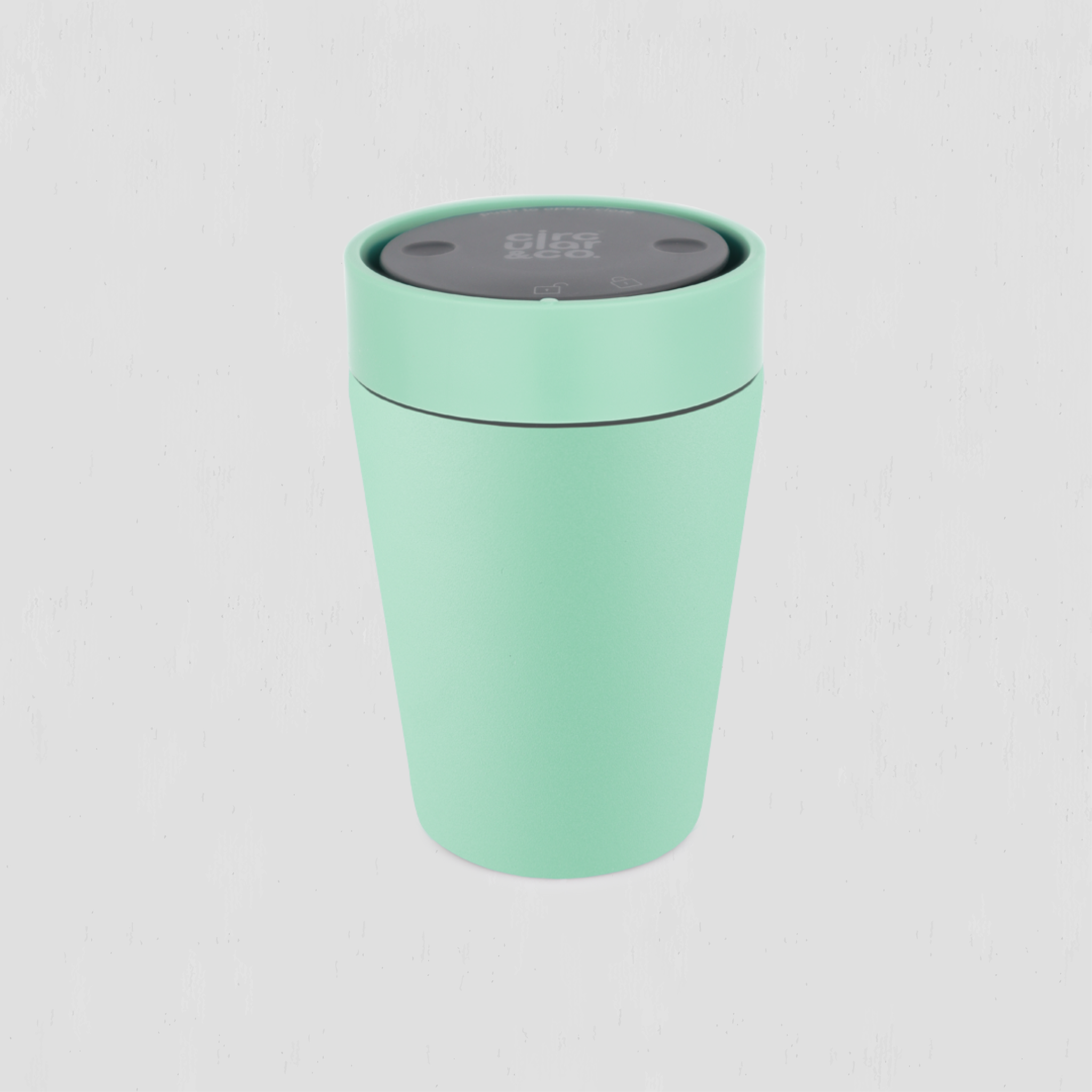 A mint green thermal travel cup with a dark gray lid, shown on a light gray background.