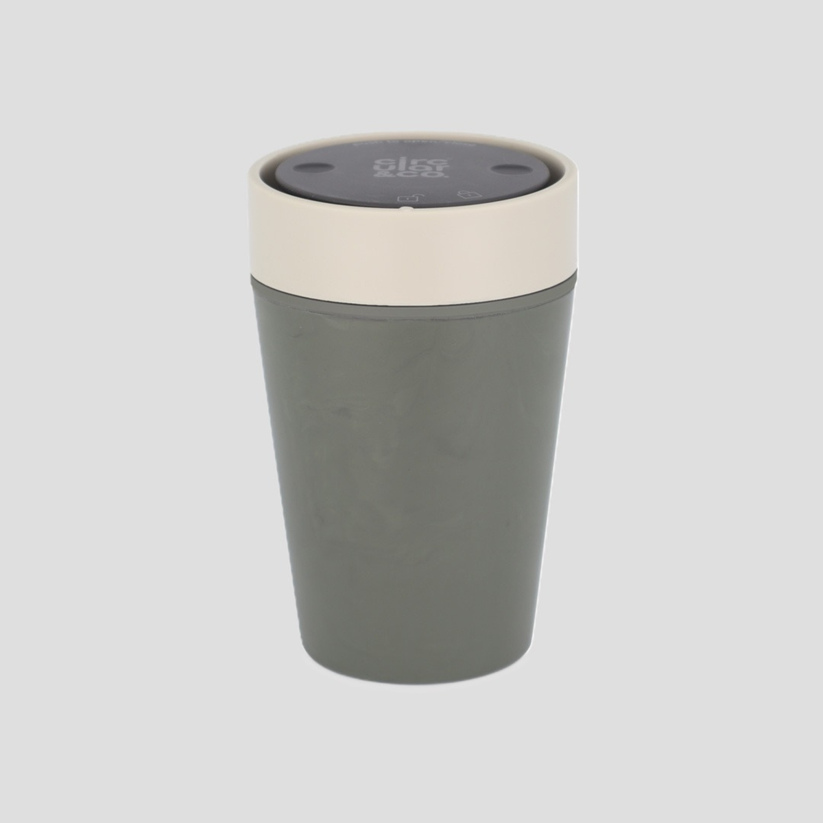 A matte gray travel tumbler with a cream-colored rim and a dark gray lid, shown on a solid light gray background.