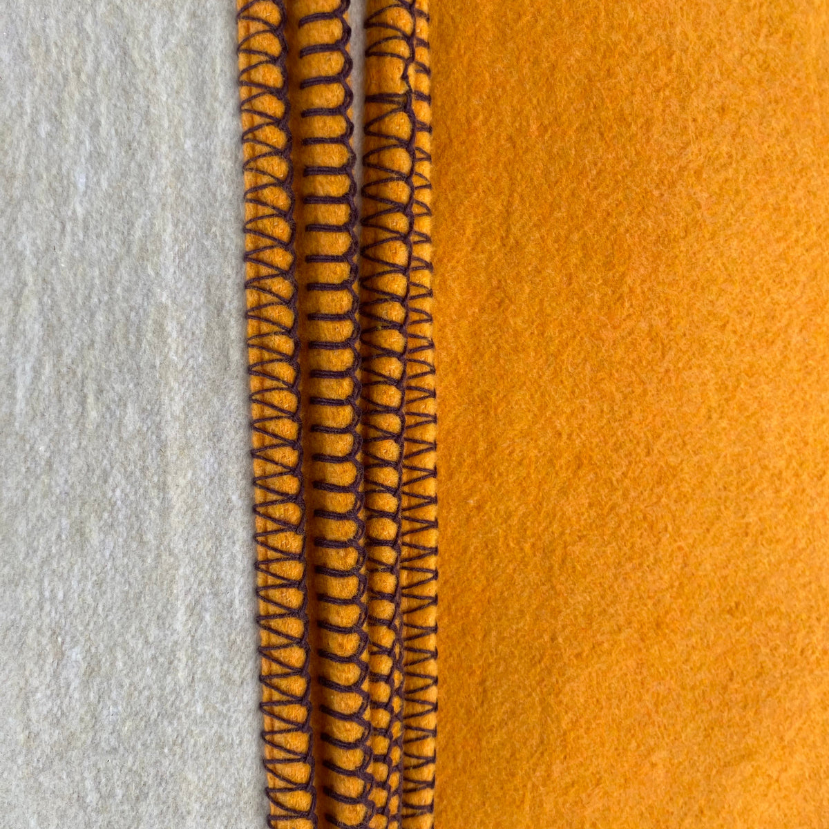 Custard recycled cotton blanket orange and beige on reverse
