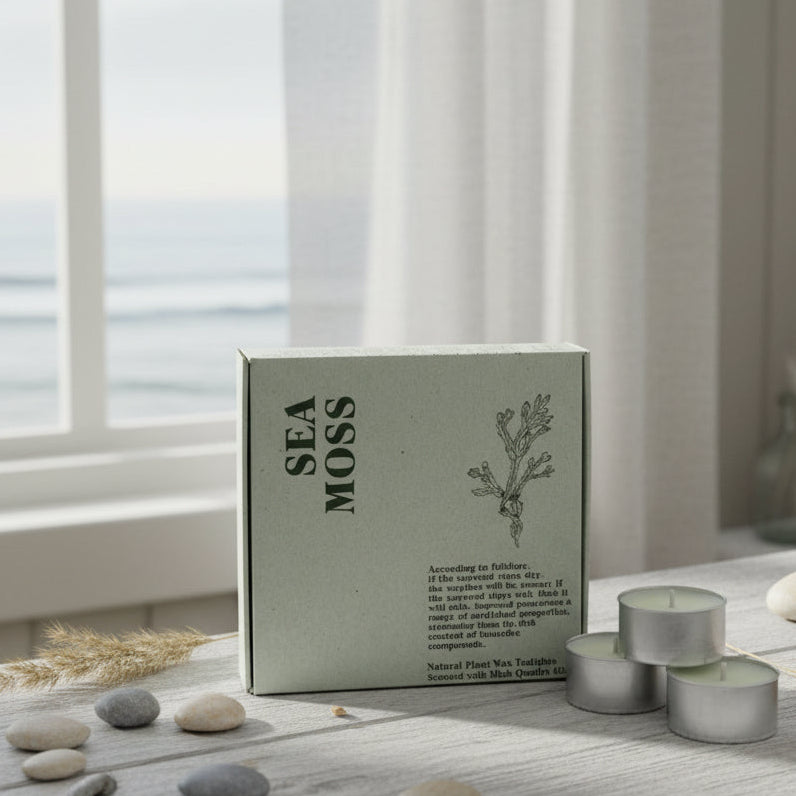 Sea Moss product with two candles on a table by a window