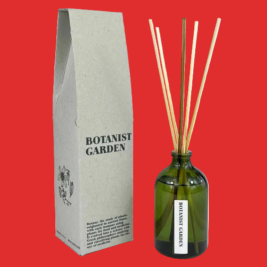 reed diffuser - botanist garden. in a green bottle