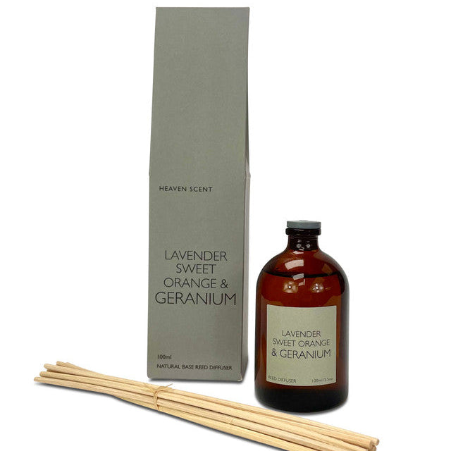 Lavender, sweet orange and geranium scented reed diffuser. Glass bottle and bundle of reeds.