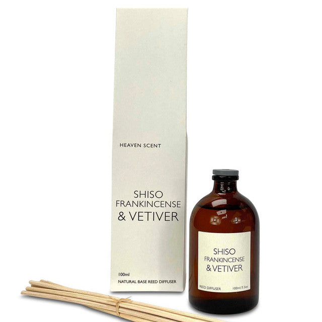 Shiso, frankincense and vetiver reed diffuser. Amber glass bottle with bundle of reeds. 