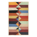Multicolored geometric patterned rug on a white background