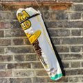 Recycled rice sack yoga bag top zip hanging against a brick wall