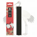 incense sticks and box with storks