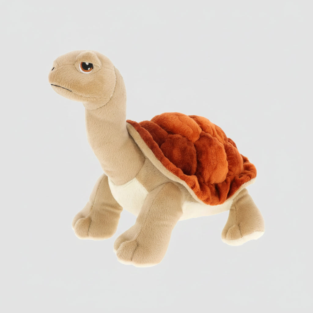 A plush tortoise toy with a beige body, cream underbelly, and a textured orange-brown shell, shown on a plain white background.
