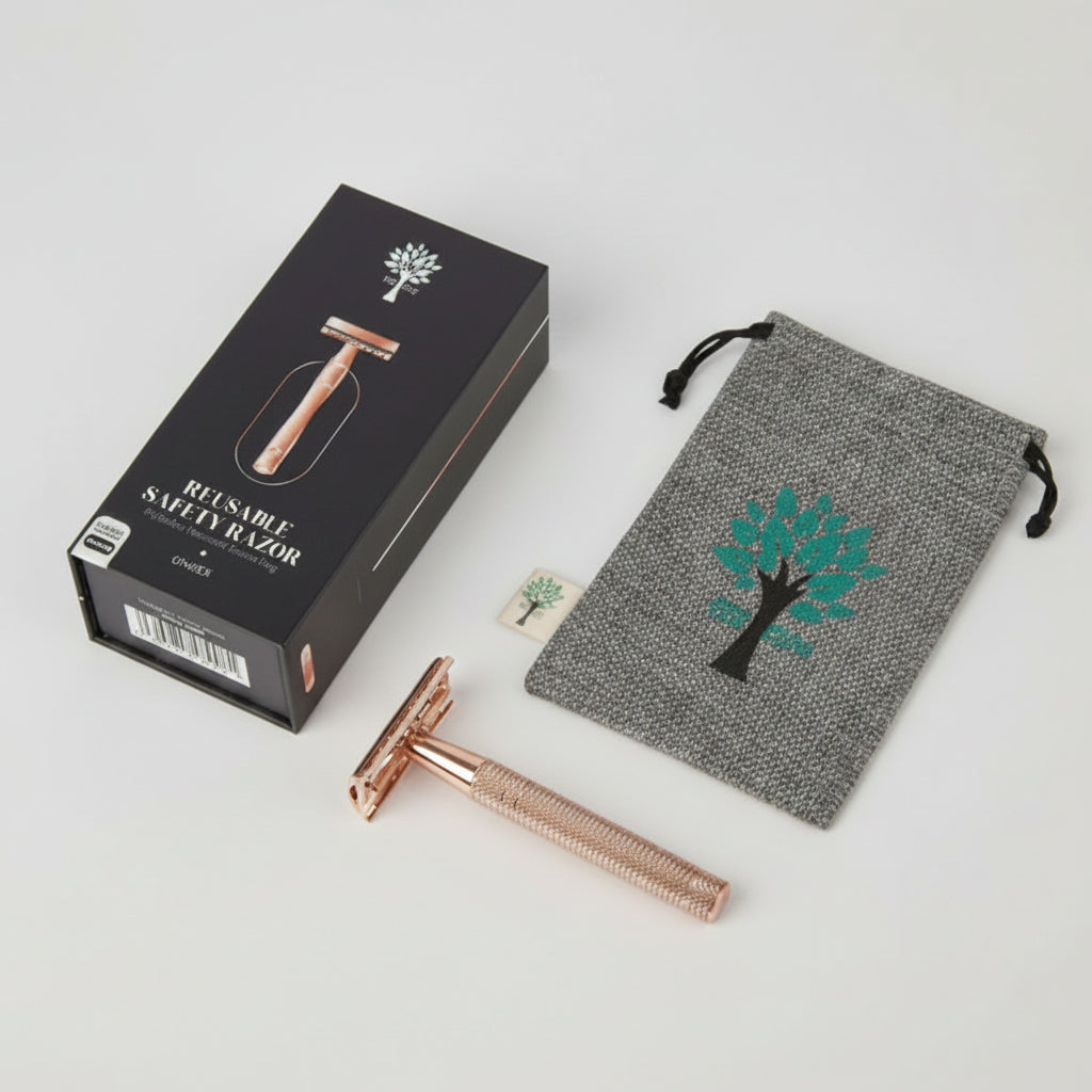 Rose gold safety razor with packaging and drawstring bag on a white background