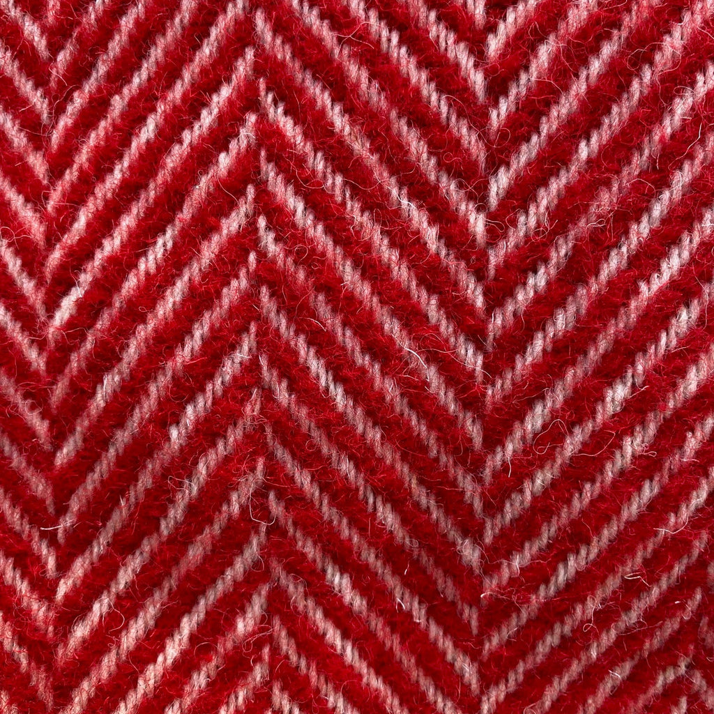 Close-up of red and white herringbone pattern blanket