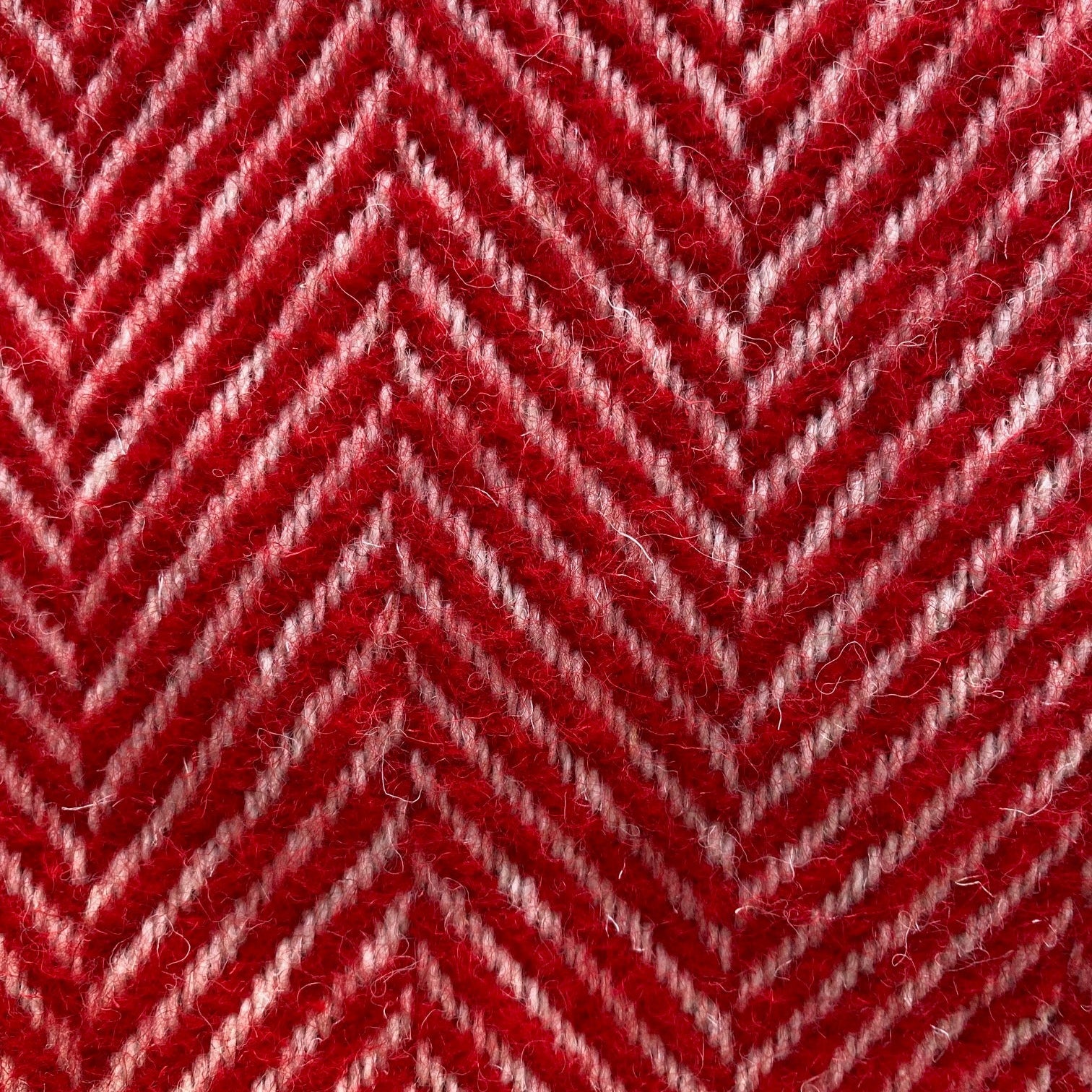 Close-up of red and white herringbone pattern blanket