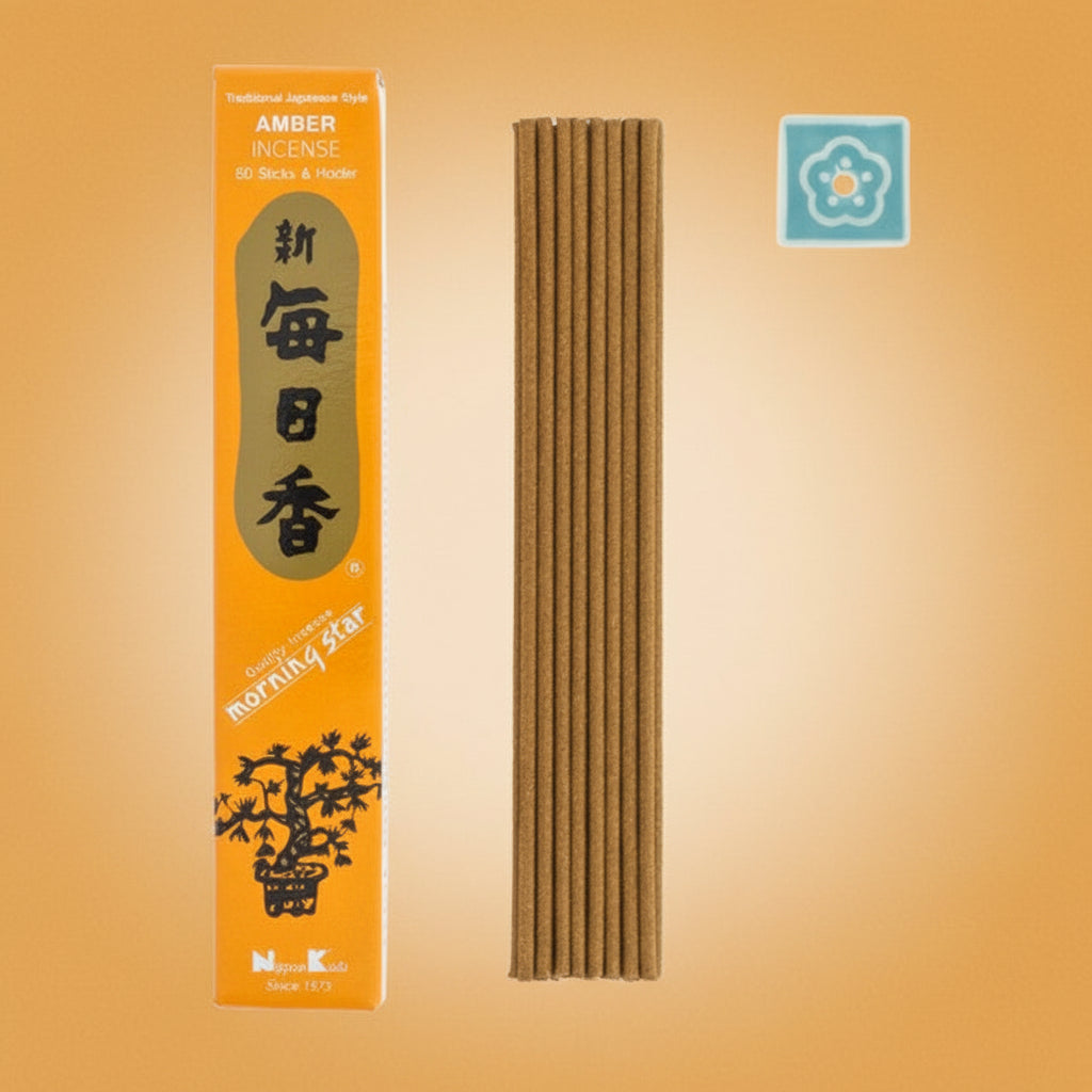 Amber incense sticks with packaging on a cream background 