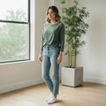 woman wearing 3-4 sleeve t shirt in olive