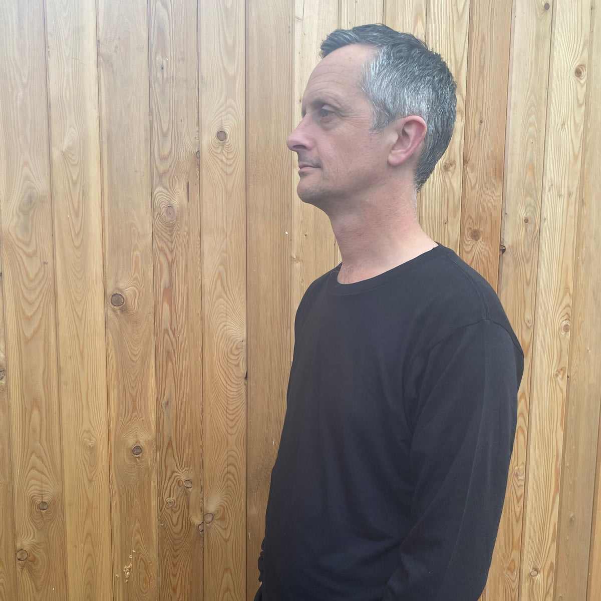 A man in a long sleeve black tshirt