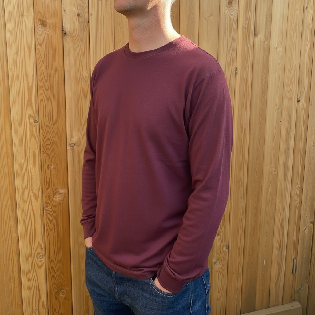 A man in a long sleeve burgundy tshirt