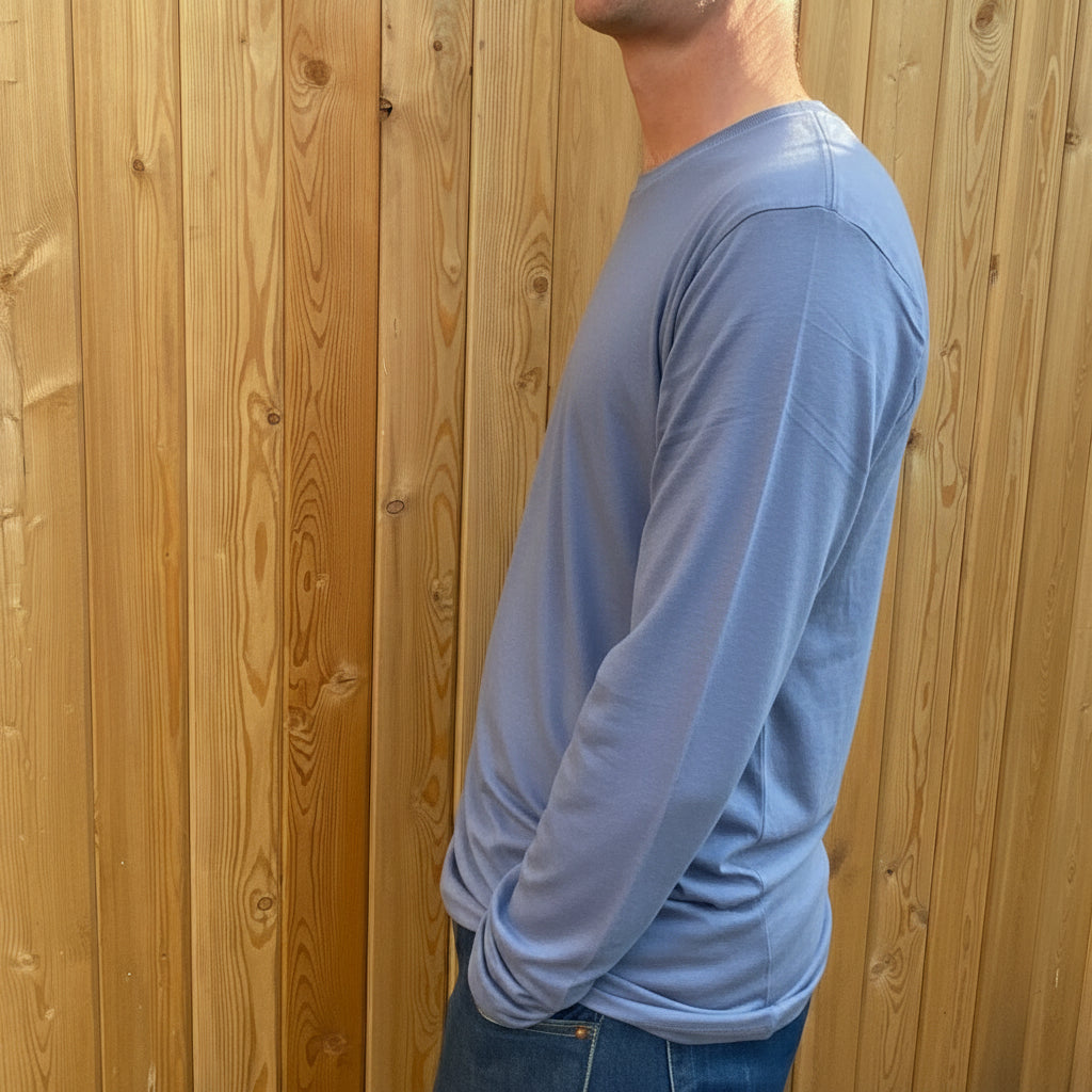 A man in a long sleeve grey tshirt