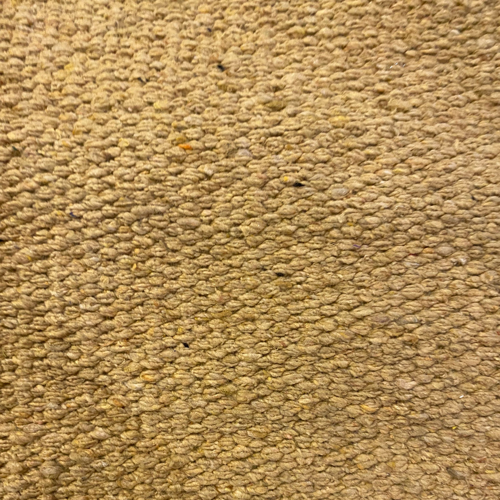 Close-up of beige textured rug