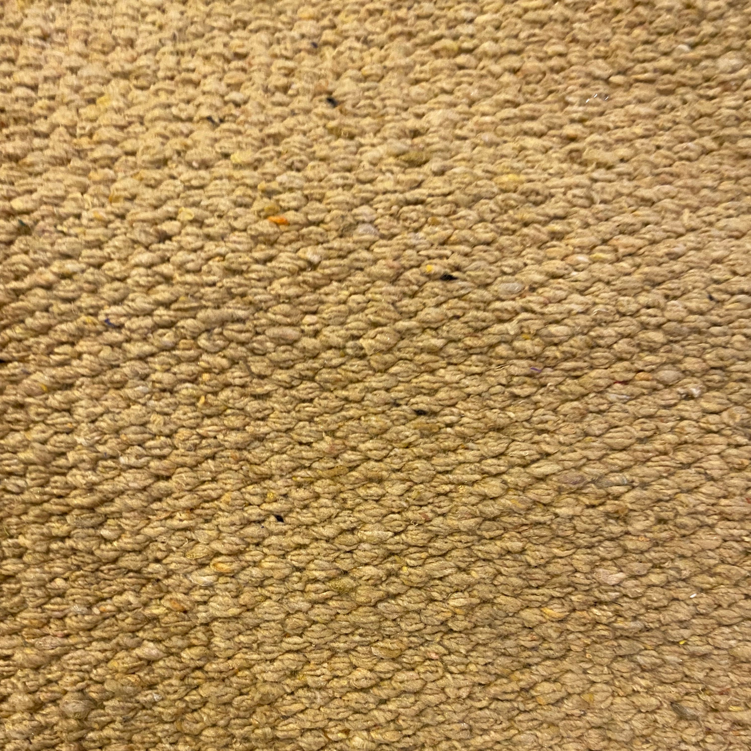 Close-up of beige textured rug