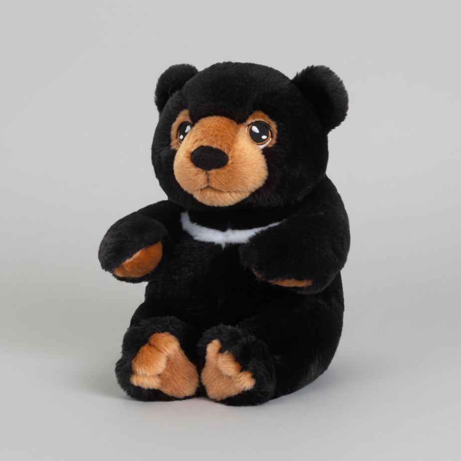 A black plush black bear toy with brown accents on its snout, paws, and inner ears, and a small white collar, embroidered eyes, shown against a plain white background.
