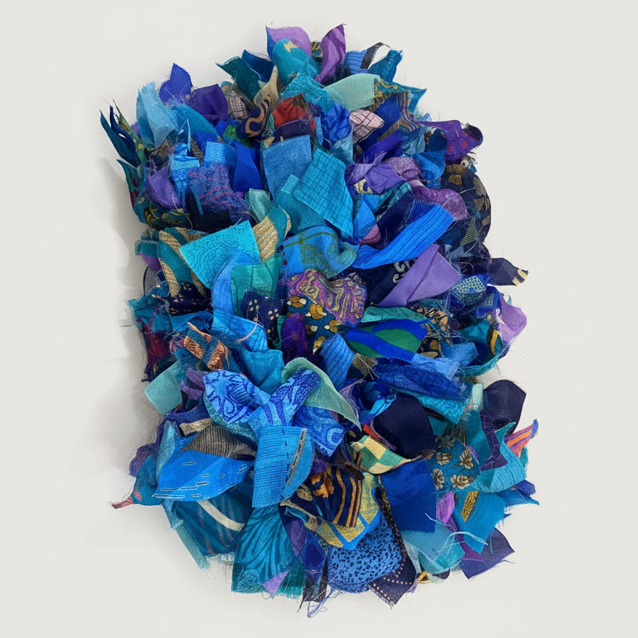 Colorful fabric wreath on a   greybackground