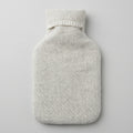 hot water bottle in cream wool cover