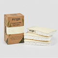 A box of Regn compostable sponges next to a stack of three natural beige loofah sponges on a white background with a faint reflection.