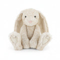 cream sitting bunny with very large ears