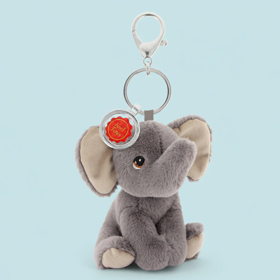 Plush elephant keychain with a silver ring and red tag on a white background