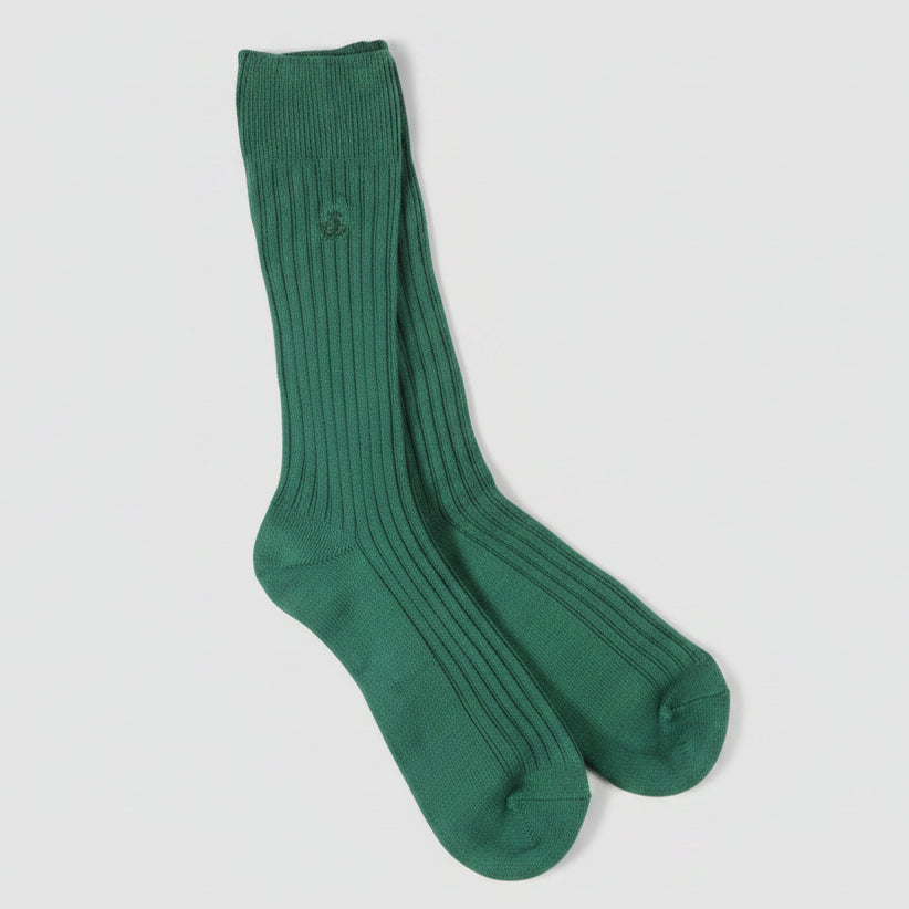 Green sock on a light gray background