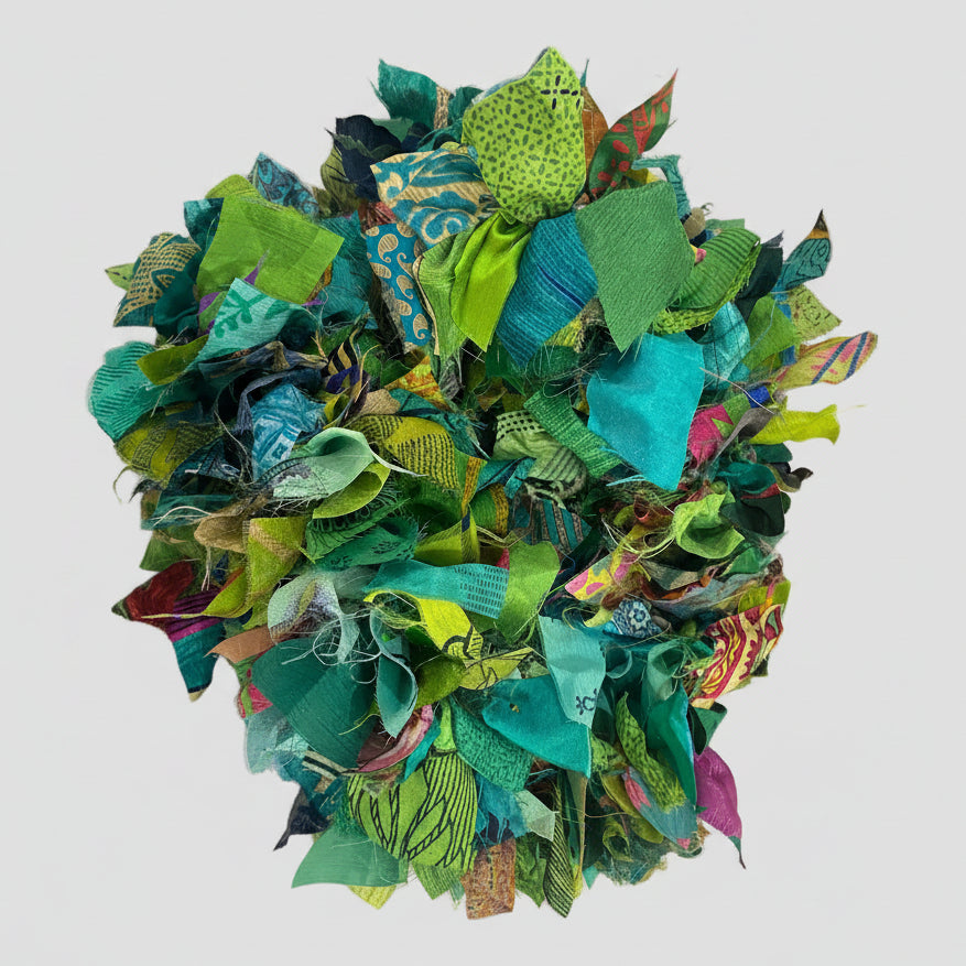 Colorful fabric garland on a grey background