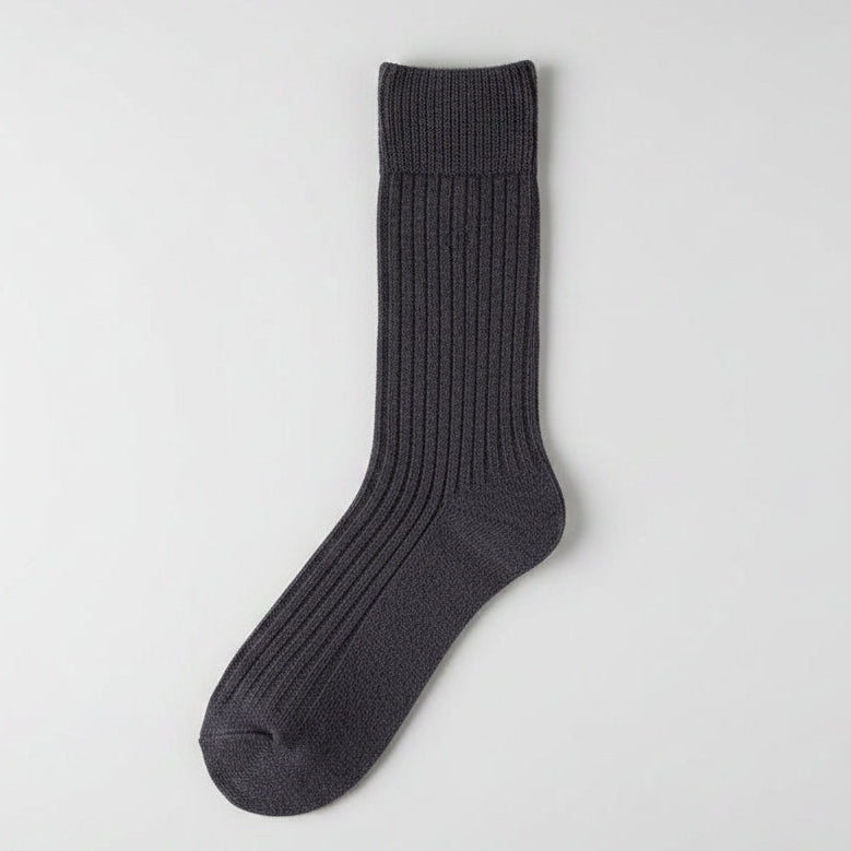 Pair of dark gray socks on a white background