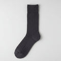 A single dark charcoal blue ribbed knit sock displayed flat against a light gray background.