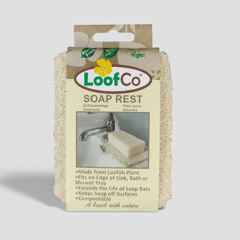 LoofCo Soap Rest natural loofah plant-based soap rest, shown in its retail packaging, featuring a beige background with product details and a photo of the soap rest in use.