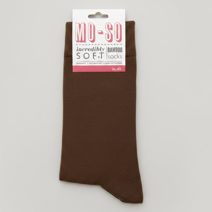 a pair of brown mo-so socks on a grey background