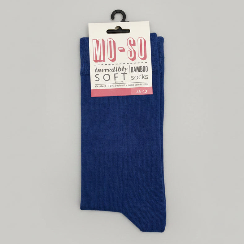 a pair of mo-so socks in denim on a grey background