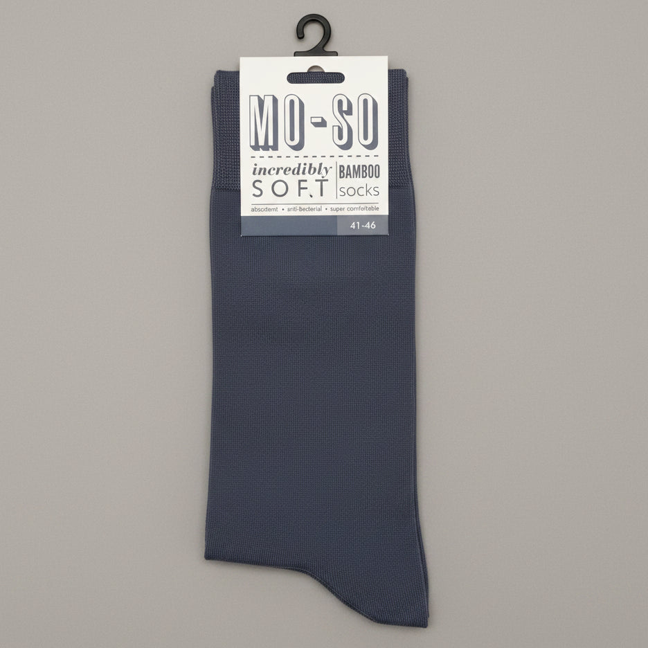 a pair of grey mo-so socks size 7-11 on a grey background