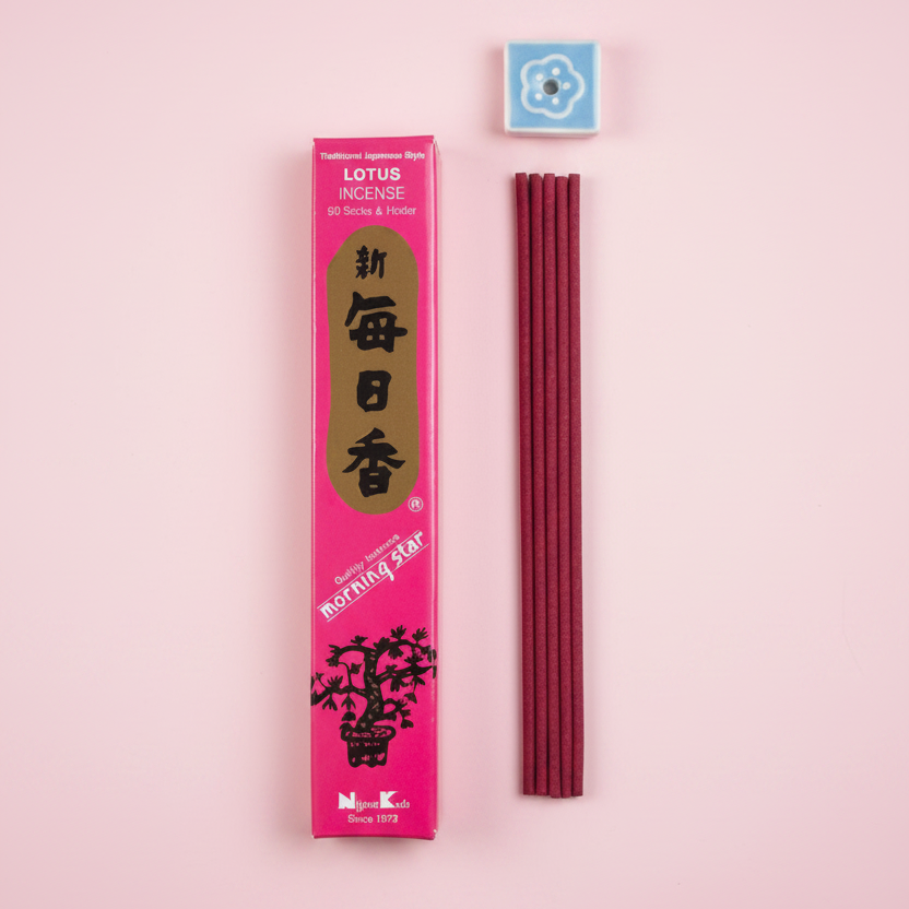 Incense sticks with a pink packaging labeled 'Lotus' on a pink background