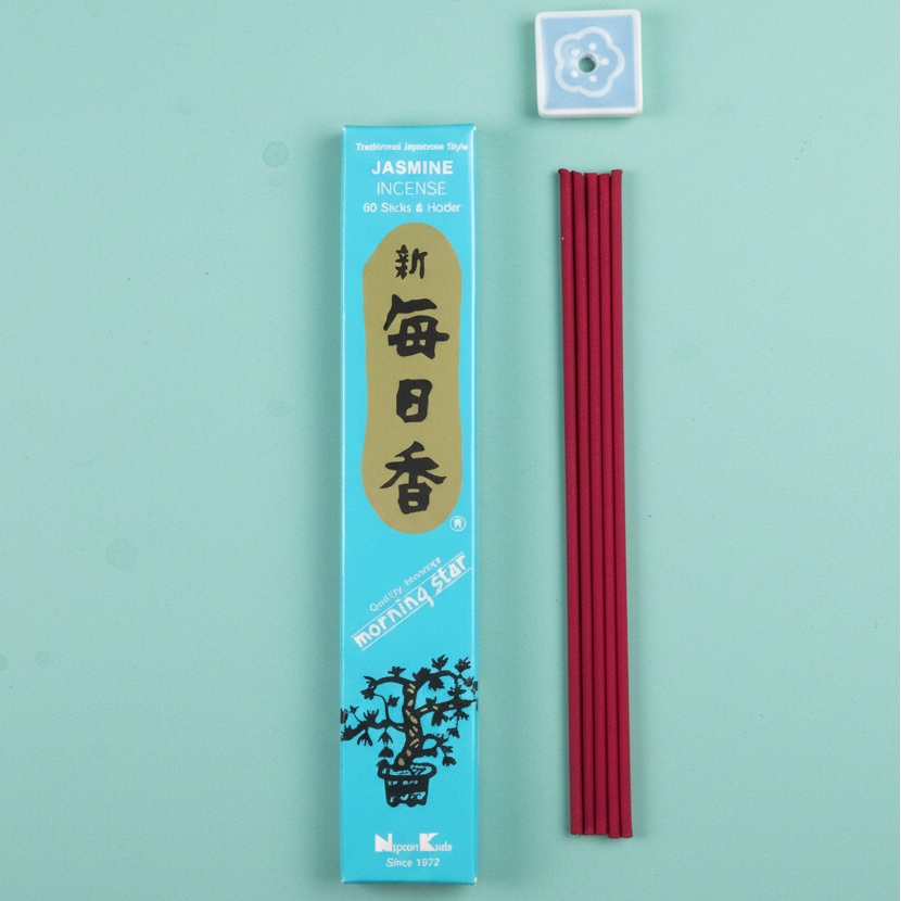 Incense sticks with a blue packaging on a blue background