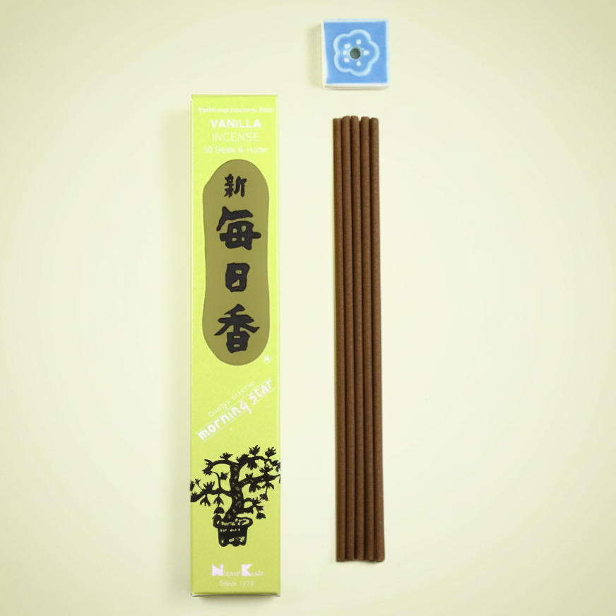 Incense sticks with packaging on a yellow background
