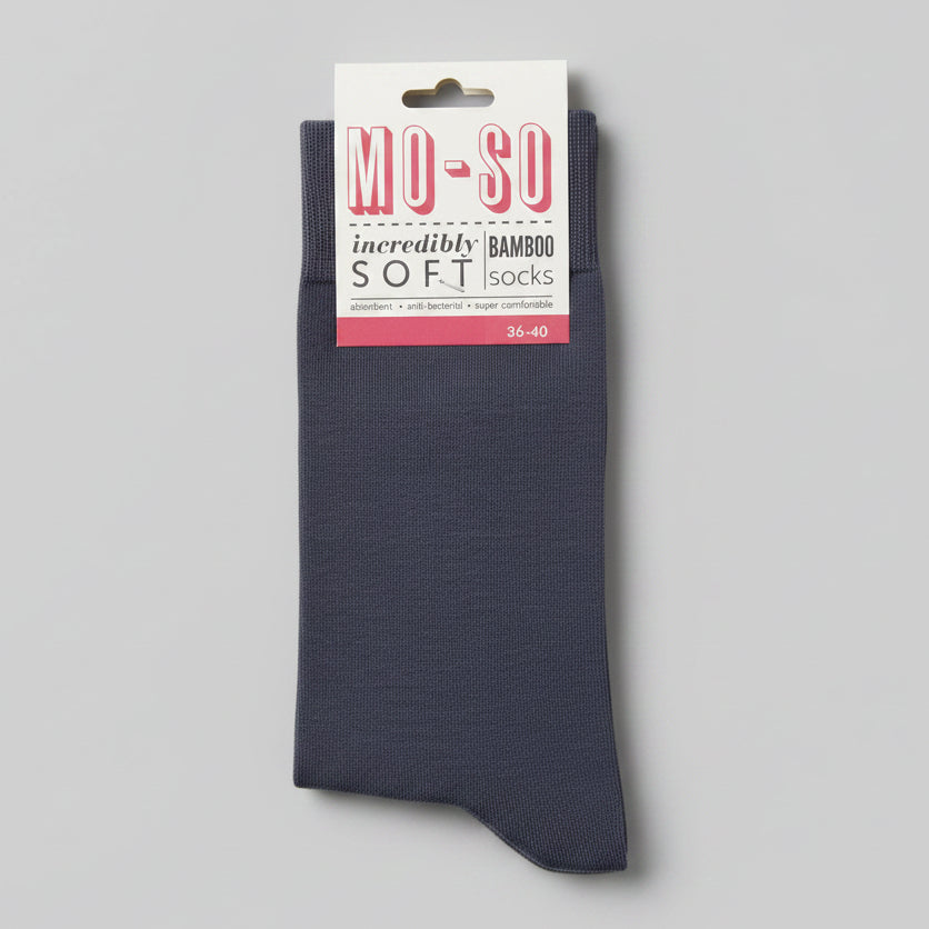 a pair of grey socks branded moso on a grey background