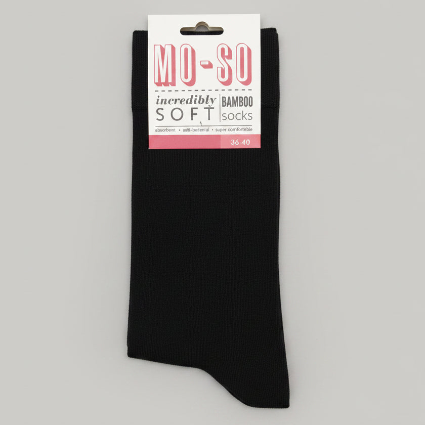 pair of black socks branded mo so on white background