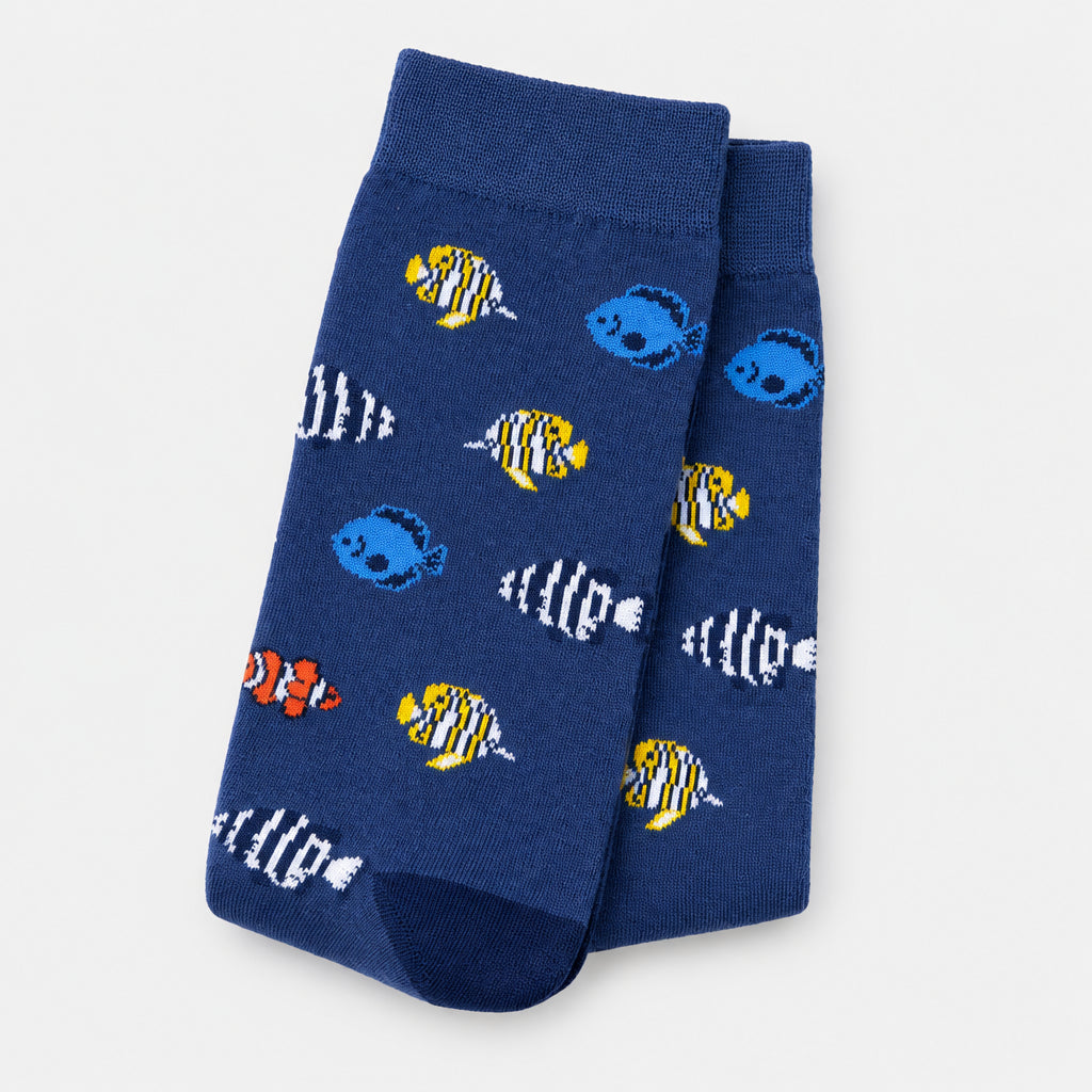 Blue socks with fish pattern on a light gray background