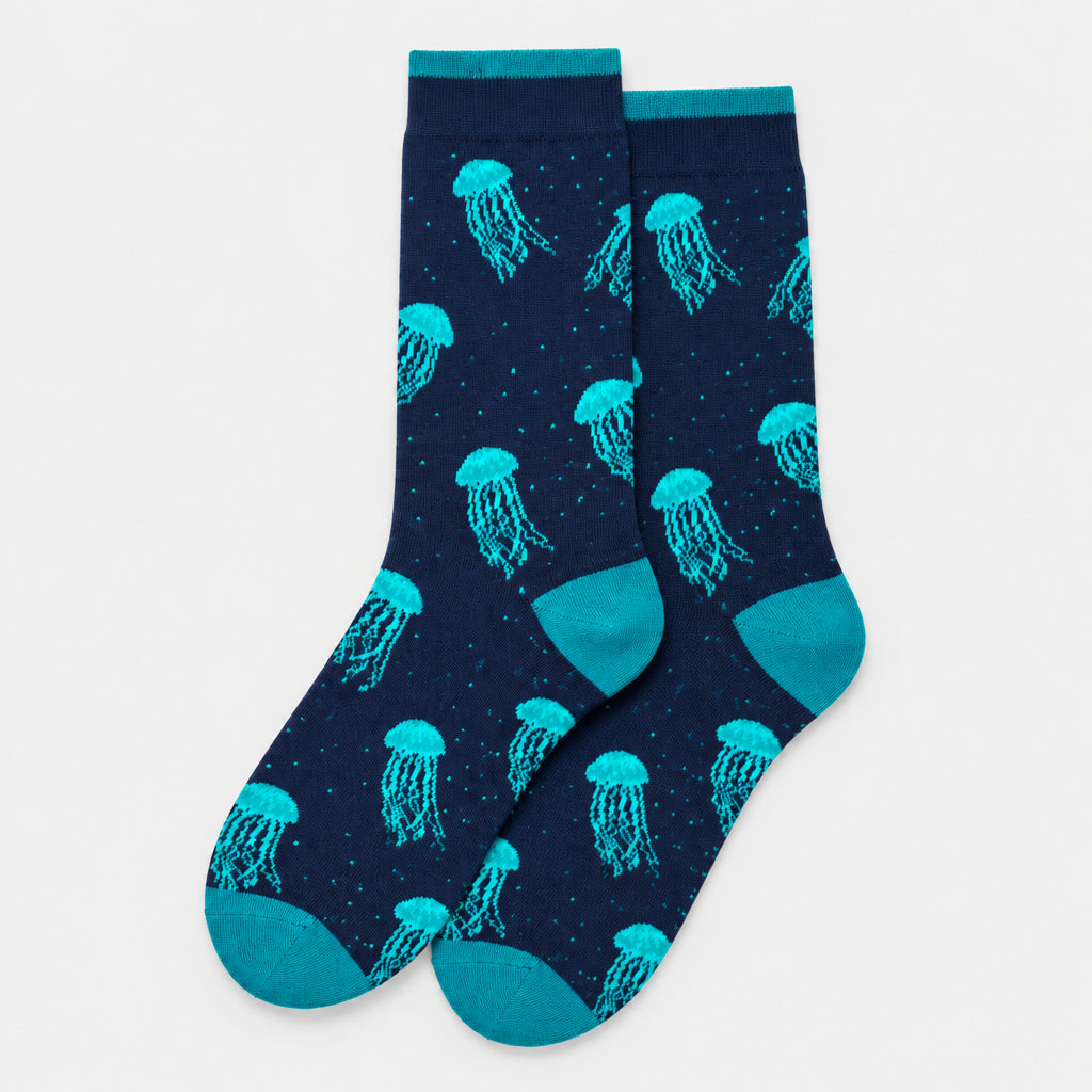 Navy socks with teal jellyfish pattern on a white background