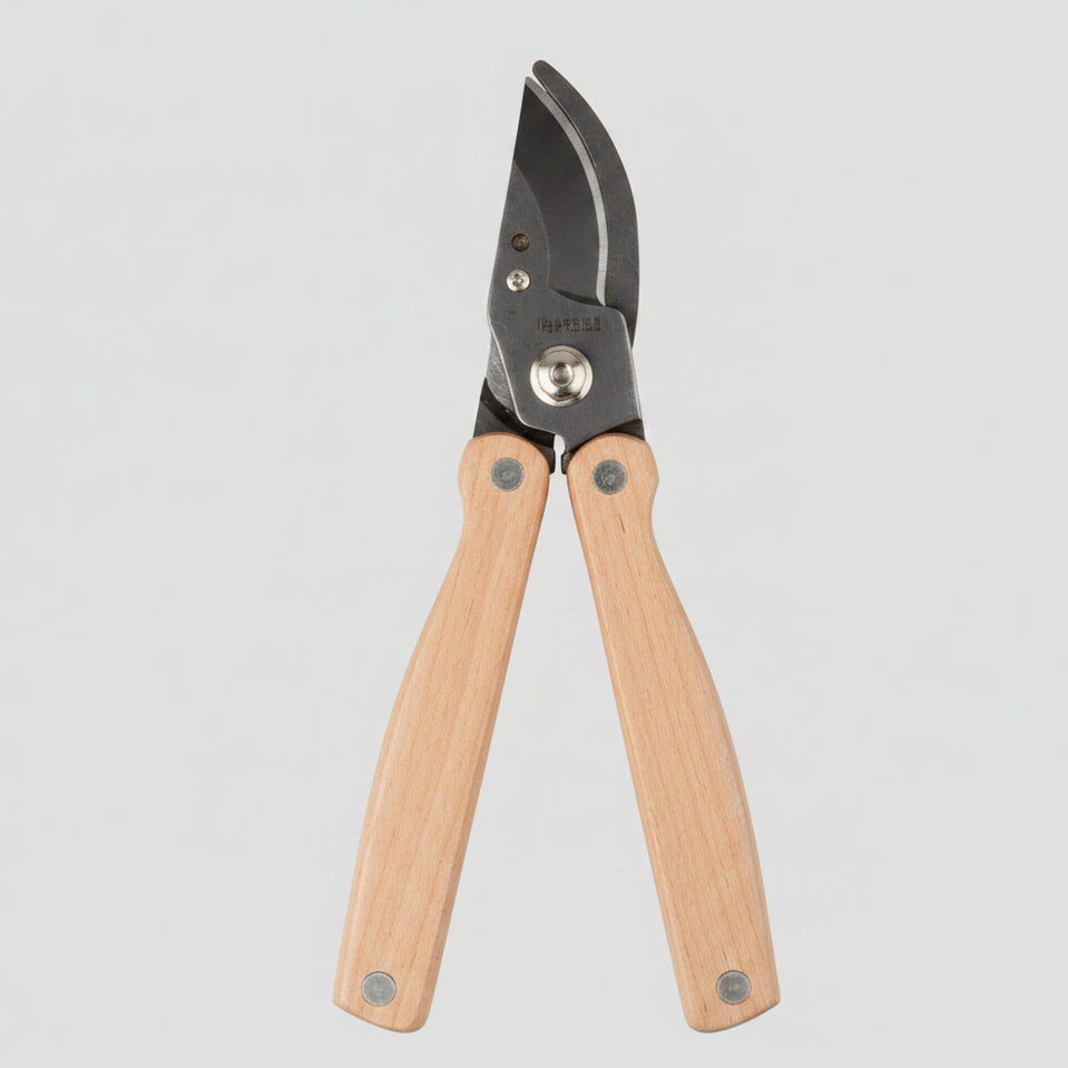 Garden pruner with wooden handles on a white background