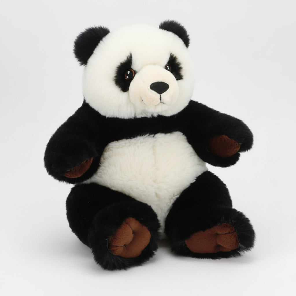 A plush panda toy sitting upright against a plain white background. The toy has a soft black and white fur pattern with brown accents on its inner ears, paw pads, and feet.