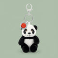 Plush panda keychain with a red emblem on a white background