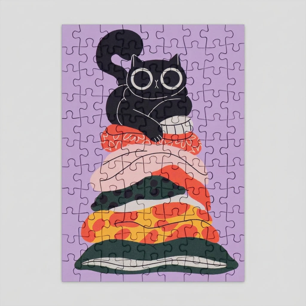 Jigsaw puzzle with a black cat design on a purple background