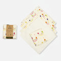 A pack of organic cotton reusable wipes with a rainbow print on one side and a plain white reverse side. The product is packaged in a cardboard box with a small branding tag.